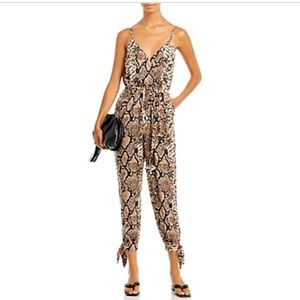 AQUA SNAKE PRINT v neck JUMPSUIT. NWT SZ small.